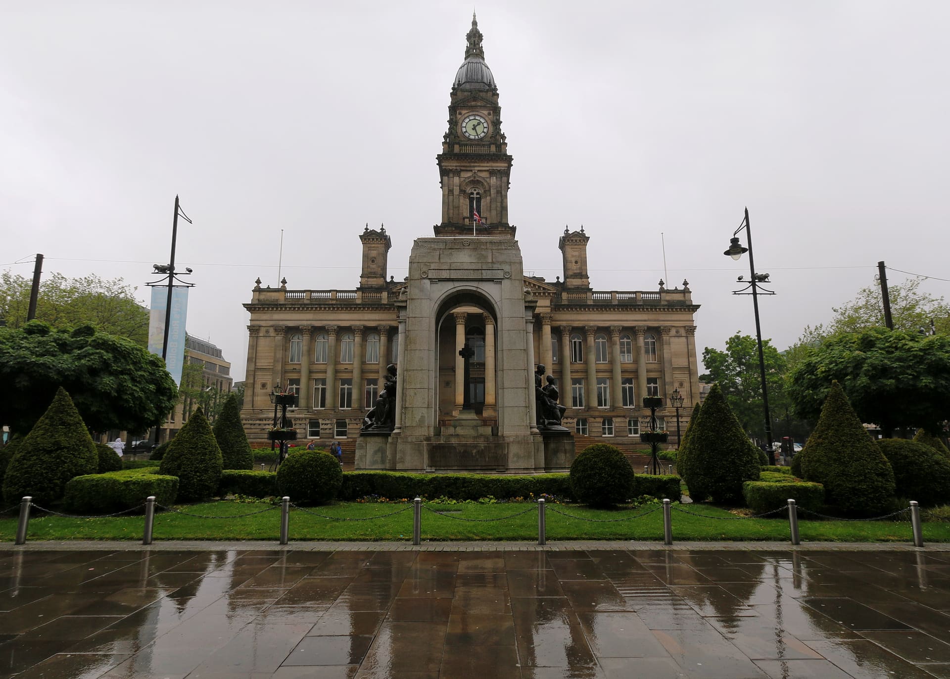 Bolton Town Hall across a wet Victoria Square.