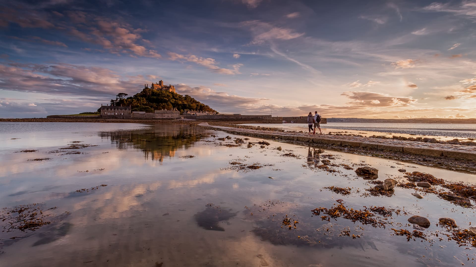 St Michael's Mount across the wet sand at low tide.