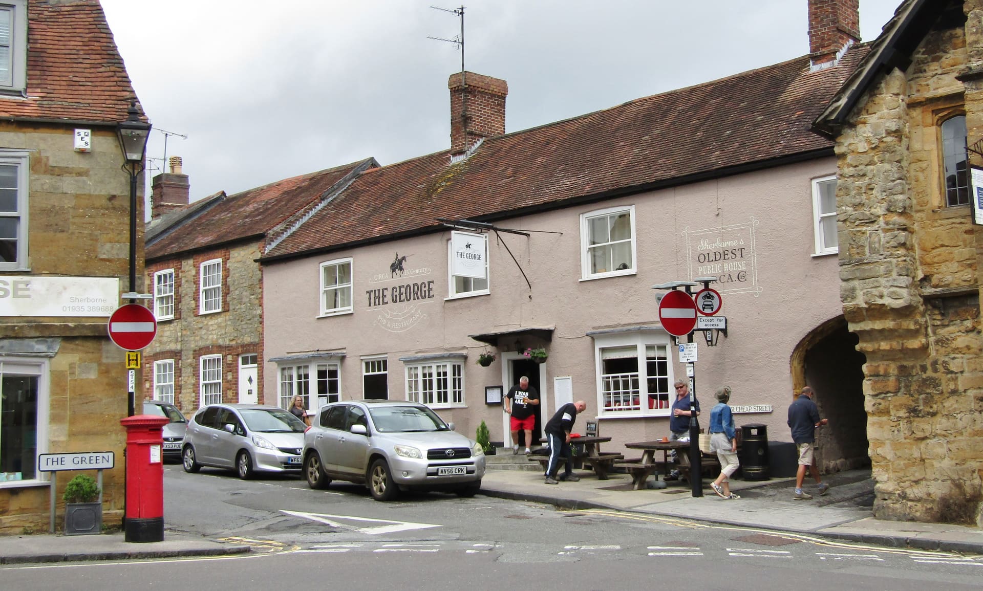 Golden ham-stone frontages around the George in Sherborne.