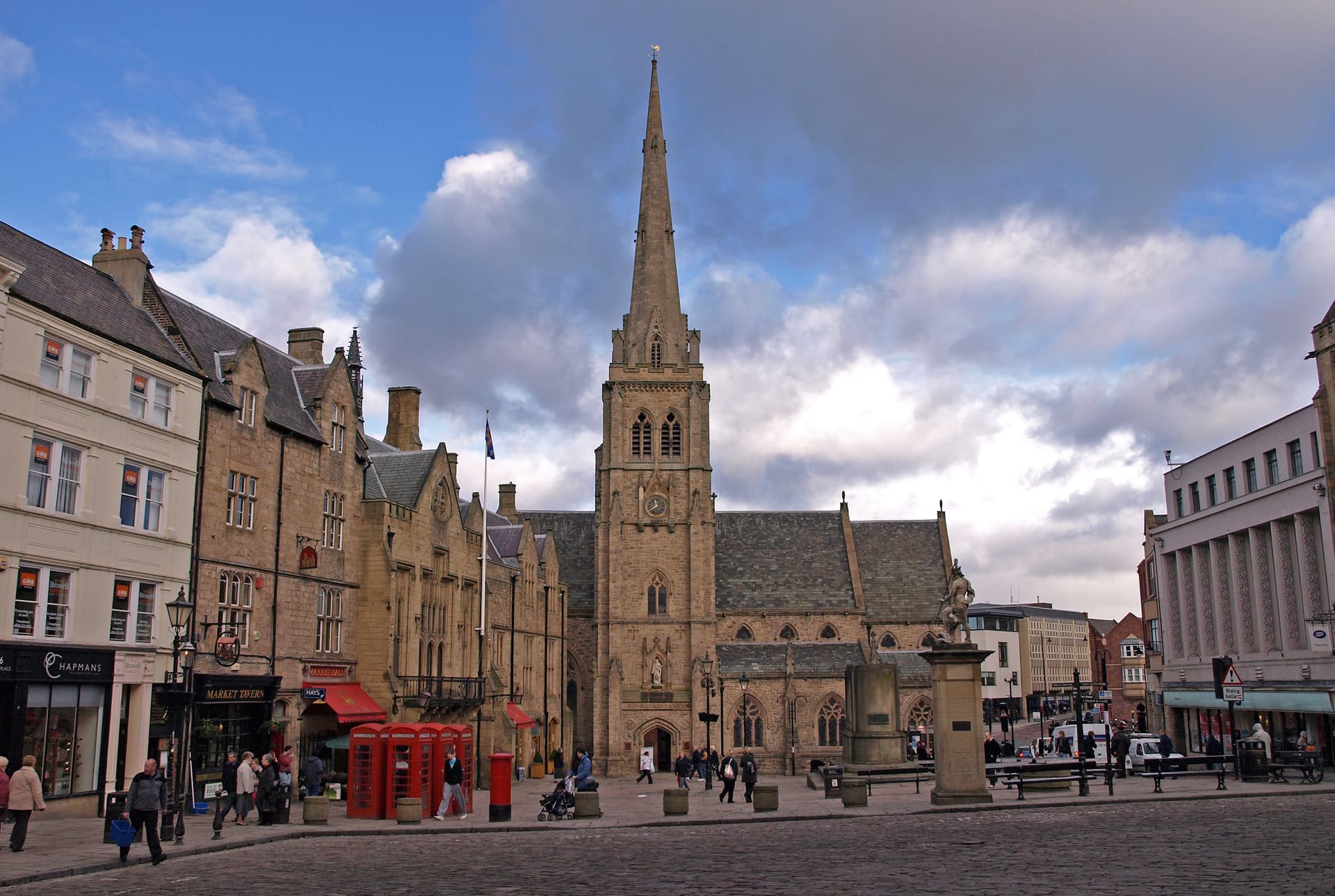 Durham Market Place and the spire of St Nicholas' church under heavy cloud.