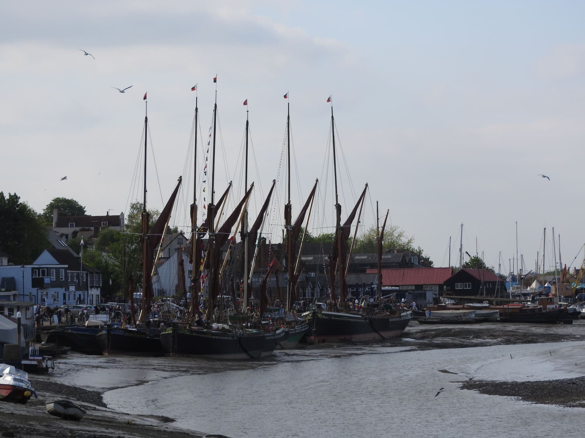 Thames sailing barges moored on the mud at Hythe Quay, Maldon.