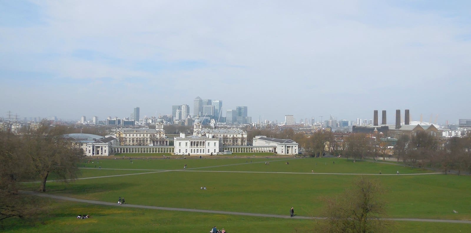 The Queen's House and Old Royal Naval College from Greenwich Park, Canary Wharf beyond.