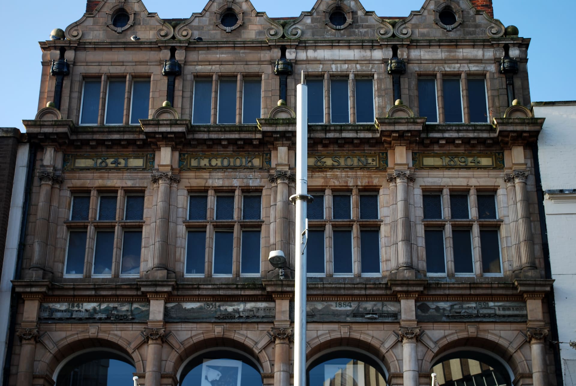 The stone facade of the Thomas Cook Building in Leicester.
