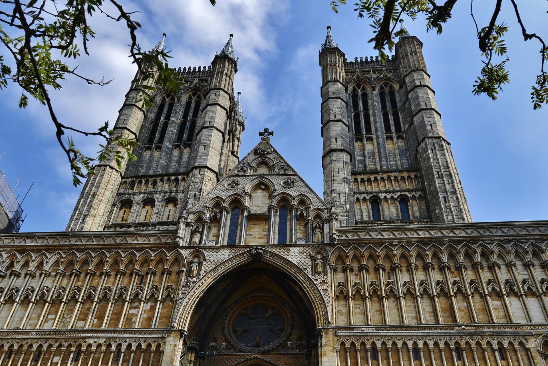 The twin west towers of Lincoln Cathedral seen from below.