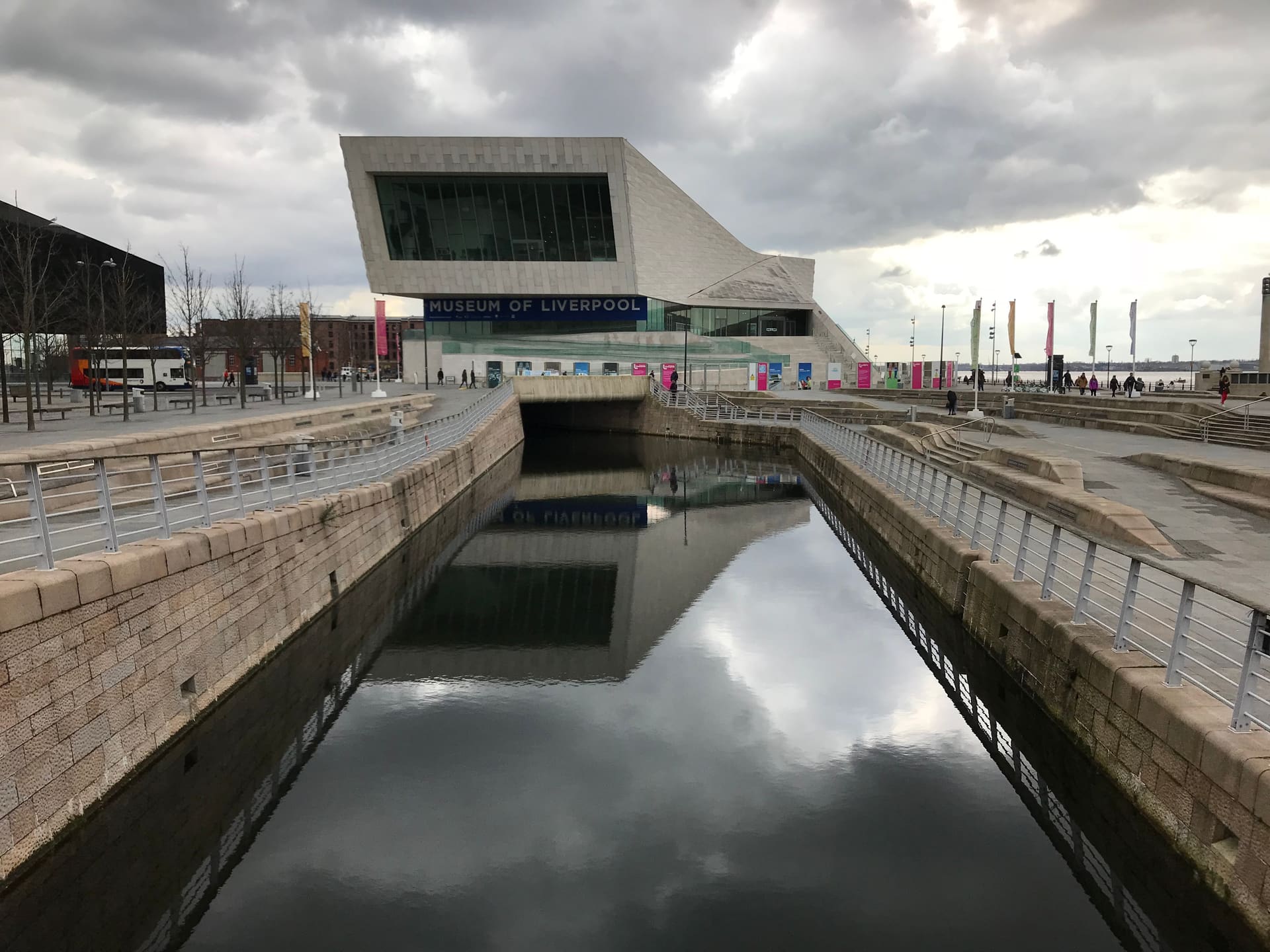 The canal link reflecting the Museum of Liverpool at Pier Head.