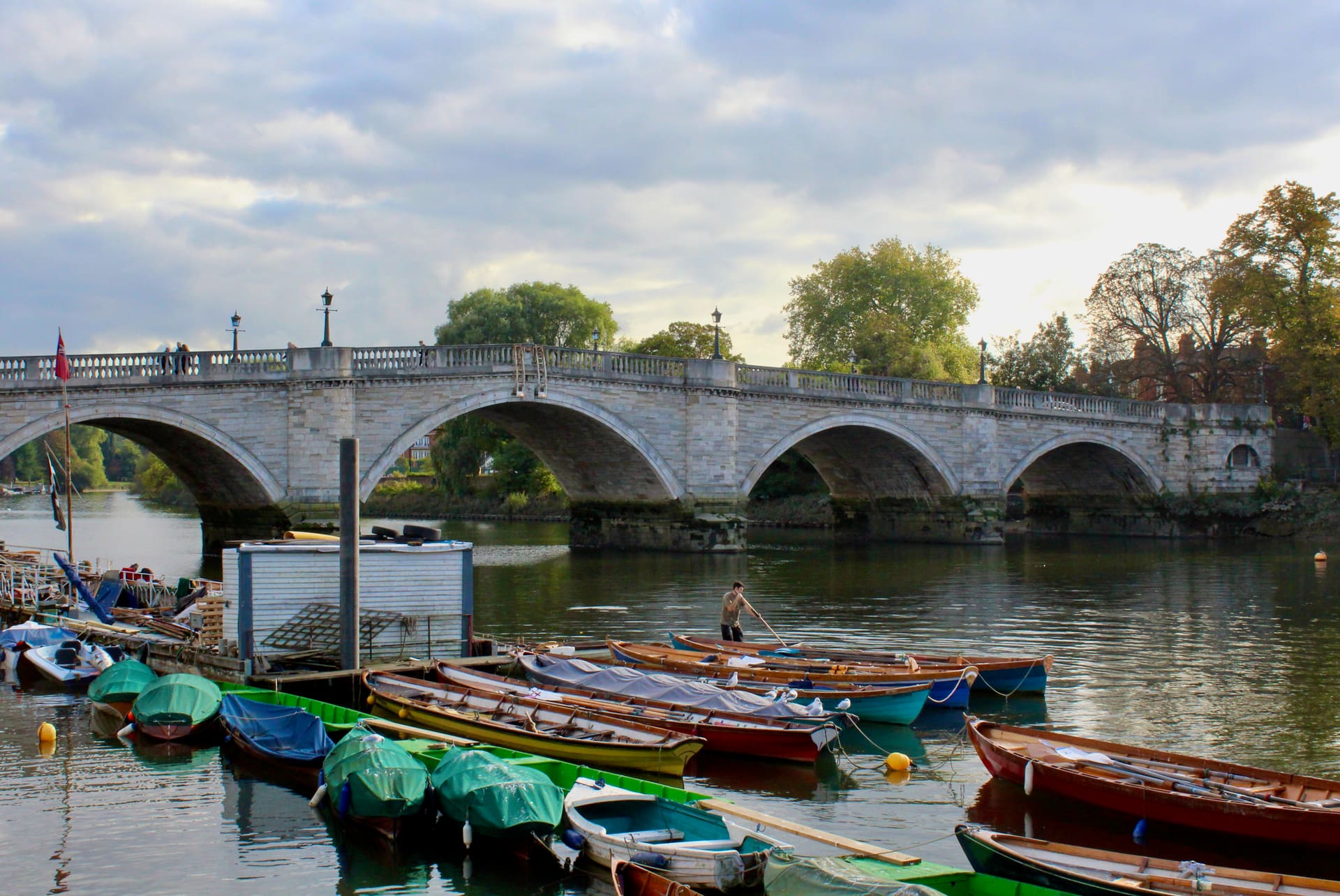 Skiffs moored below the arches of Richmond Bridge.