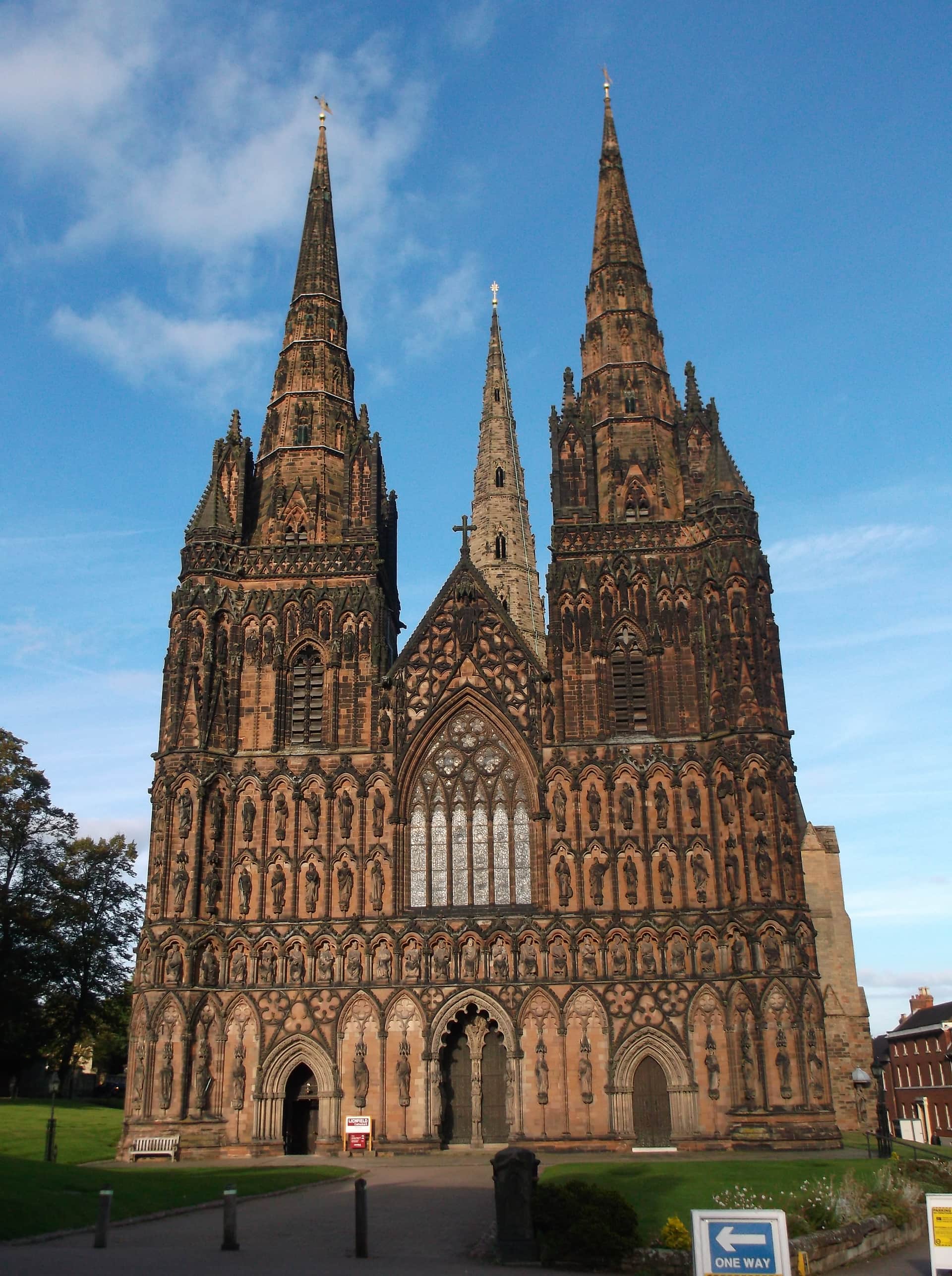 The three spires and carved west front of Lichfield Cathedral.