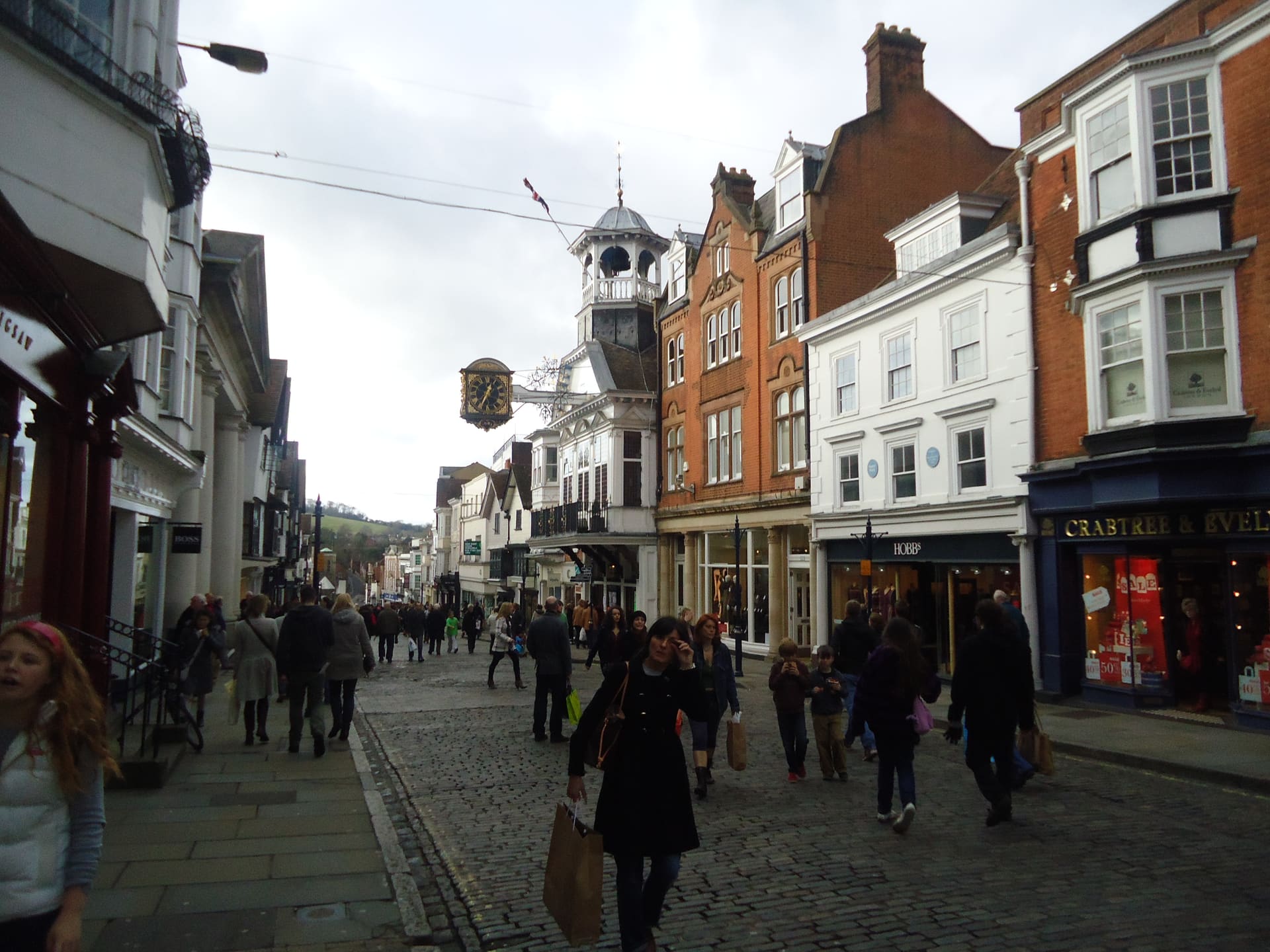Guildford High Street's granite setts and the Guildhall clock.